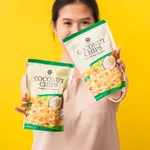 Merubali team member holding two packs of Merubali coconut chips